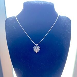 - - Phenacite / Phenakite crystal in heart locket